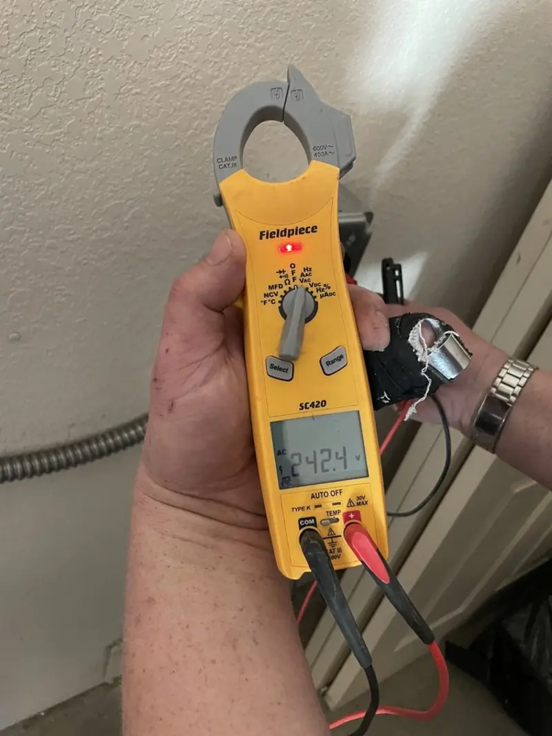 Voltage testing with clamp meter during Ceiling Fan Installation in Amite City
